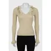 Jumper with frills on sleeves and collar