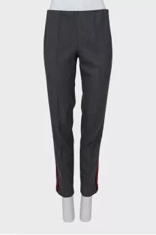 Trousers with red and black stripes on the sides