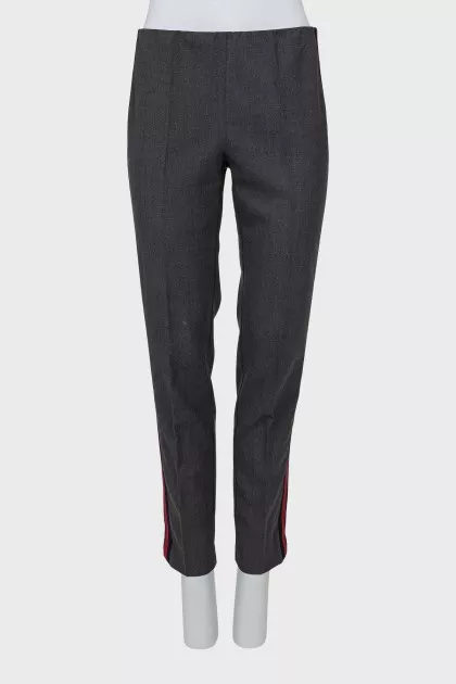 Trousers with red and black stripes on the sides