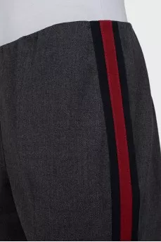 Trousers with red and black stripes on the sides