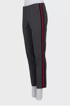Trousers with red and black stripes on the sides