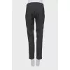 Trousers with red and black stripes on the sides