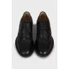 Men's brogues decorated with perforation