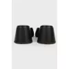 Black leather mugles with a sharp toe