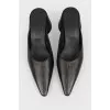 Black leather mugles with a sharp toe