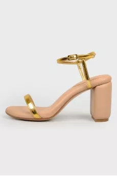 Beige sandals with golden straps