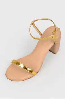 Beige sandals with golden straps