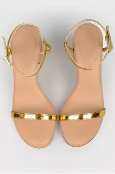 Beige sandals with golden straps