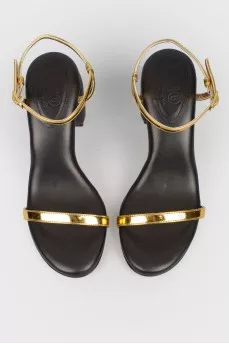 Black sandals with golden straps