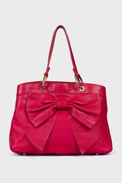 Leather bag decorated with a bow