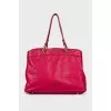 Leather bag decorated with a bow