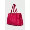 Leather bag decorated with a bow