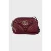 Burgundy leather bag with tag