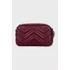 Burgundy leather bag with tag
