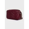 Burgundy leather bag with tag
