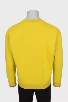 Men's yellow sweatshirt with brand logo