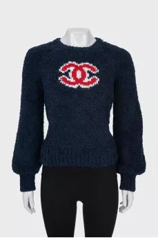 Dark blue sweater with brand logo