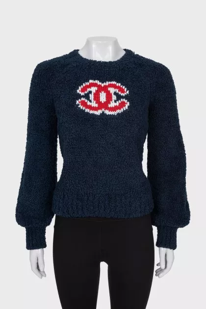 Dark blue sweater with brand logo