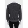 Gray sweatshirt decorated with embroidery