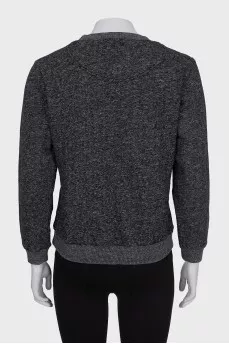 Gray sweatshirt decorated with embroidery