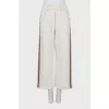 Cropped trousers with contrasting stripes