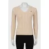 Knitted pullover in beige color