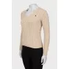 Knitted pullover in beige color