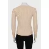 Knitted pullover in beige color