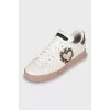 Leather sneakers with decorative elements