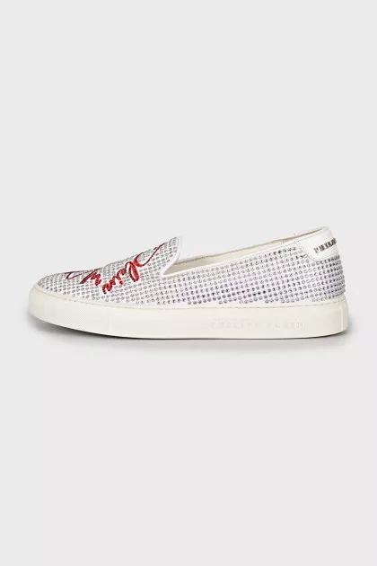 White slip-ons decorated with rhinestones
