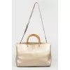 Leather bag with beige handle