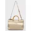 Leather bag with beige handle