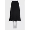 Skirt decorated with metal rings