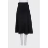 Skirt decorated with metal rings