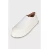 Leather slip-ons with high soles