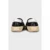 Leather slip-ons decorated with studs