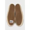 Leather slip-ons decorated with studs