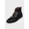 Leather boots decorated with lightning