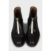 Leather boots decorated with lightning