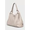 Leather bag with magnetic clasp