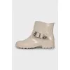 Rubber boots decorated with a strap