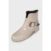 Rubber boots decorated with a strap