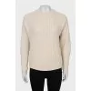 Beige sweater with a relief pattern