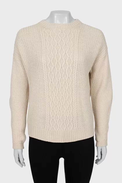 Beige sweater with a relief pattern
