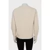Beige sweater with a relief pattern