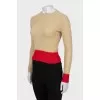 Jumper decorated with red stripes