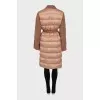 Coat decorated with fringe and tag