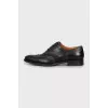 Men's black shoes with perforation