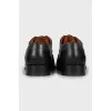 Men's black shoes with perforation