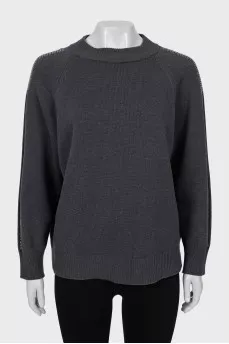 Sweater with sleeve decoration